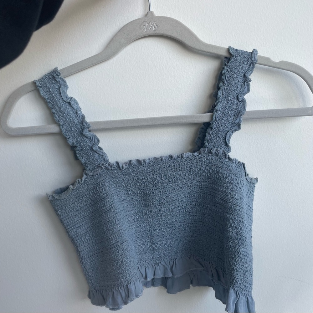 Brandy Melville crop top. Has ruffles at bottom and great texture. Stretchy!